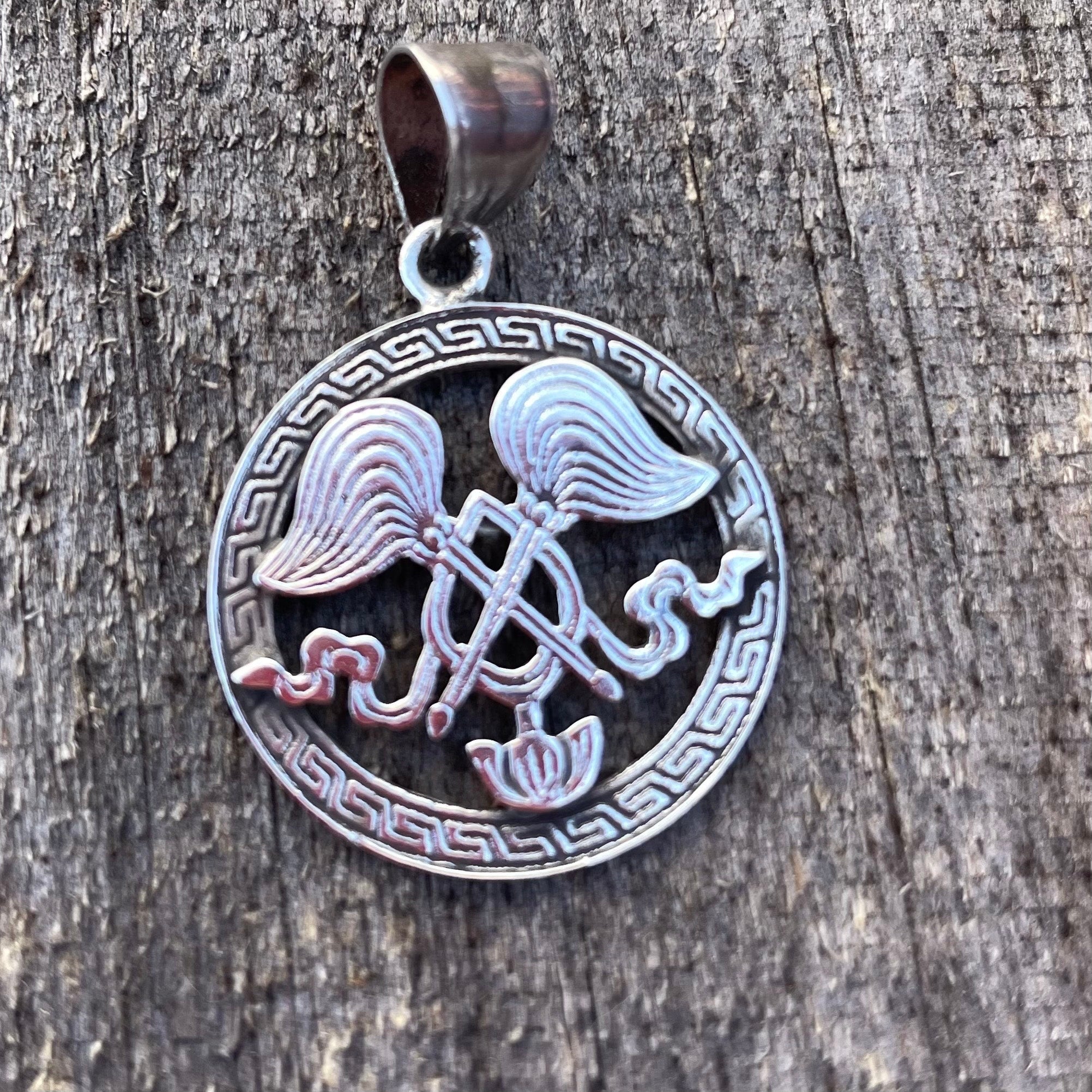 All-powerful Wheel:(Silver Pendant of Auspicious symbol) (T1102-004.9)