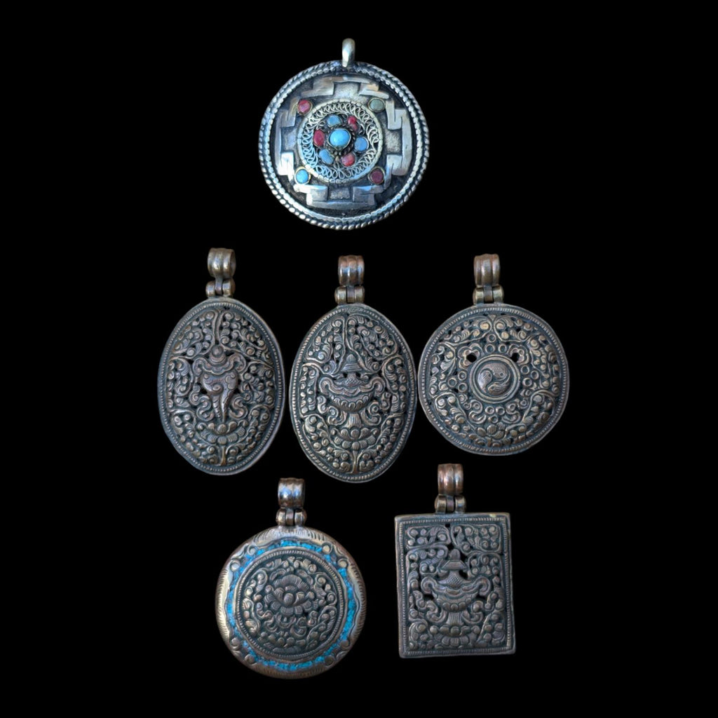PE109 Tibetan Pendant Handmade in Nepal, this auspicious Buddhist pendant is a good luck charm.