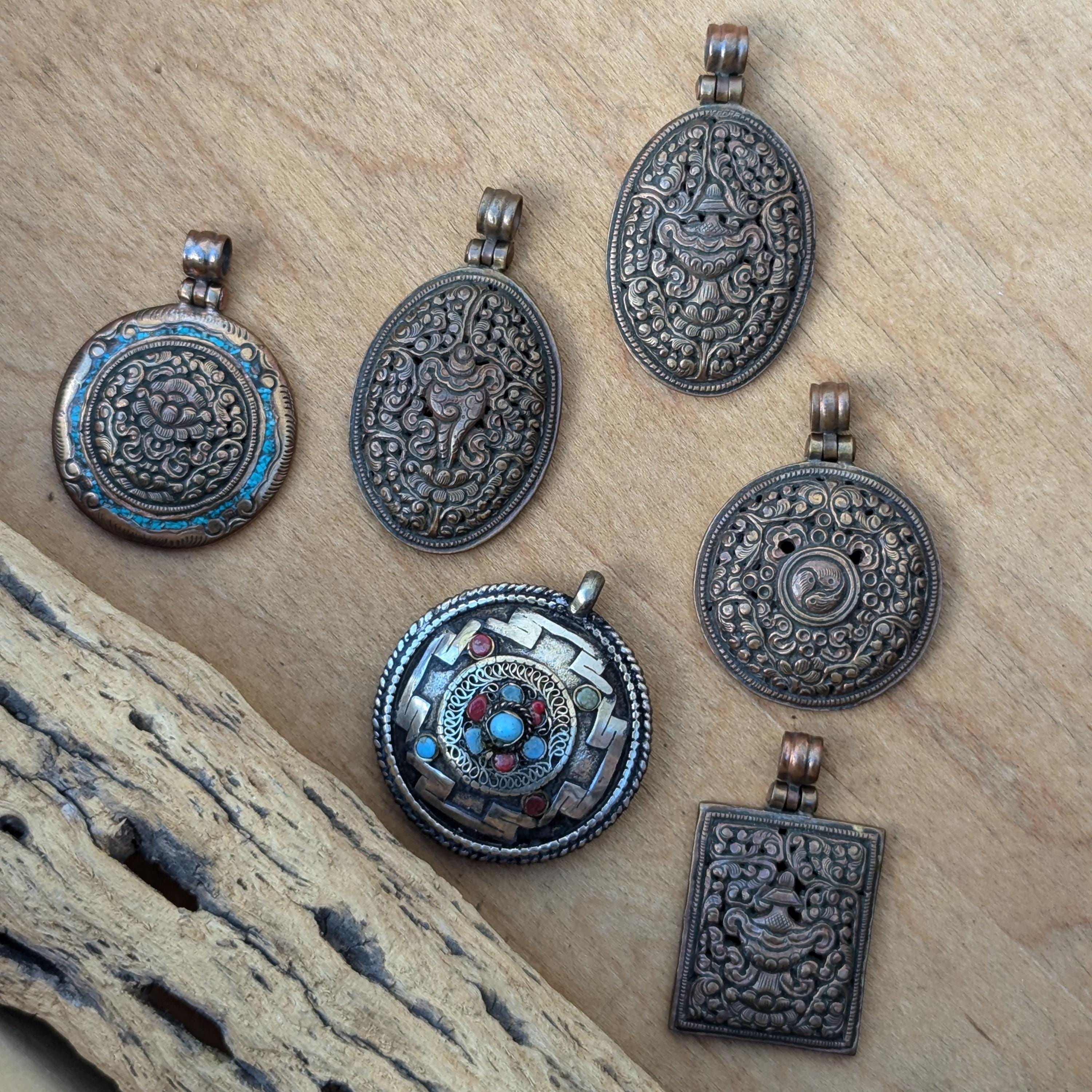 PE109 Tibetan Pendant Handmade in Nepal, this auspicious Buddhist pendant is a good luck charm.