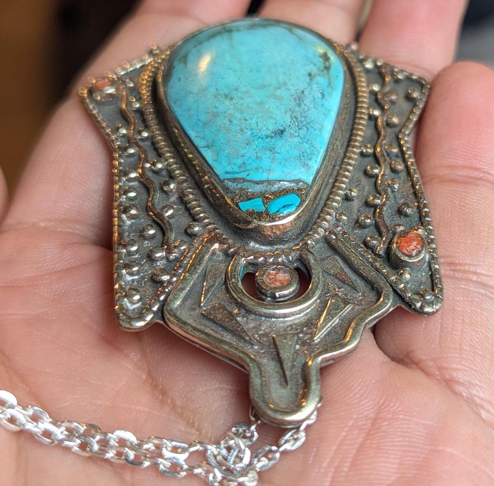 Tibetan antique ethnic pendant adorned with turquoise and coral inlays. (p6-002)