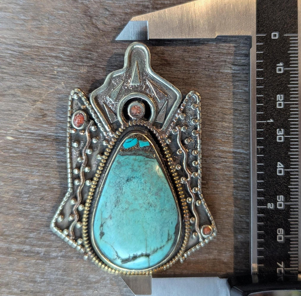 Tibetan antique ethnic pendant adorned with turquoise and coral inlays. (p6-002)