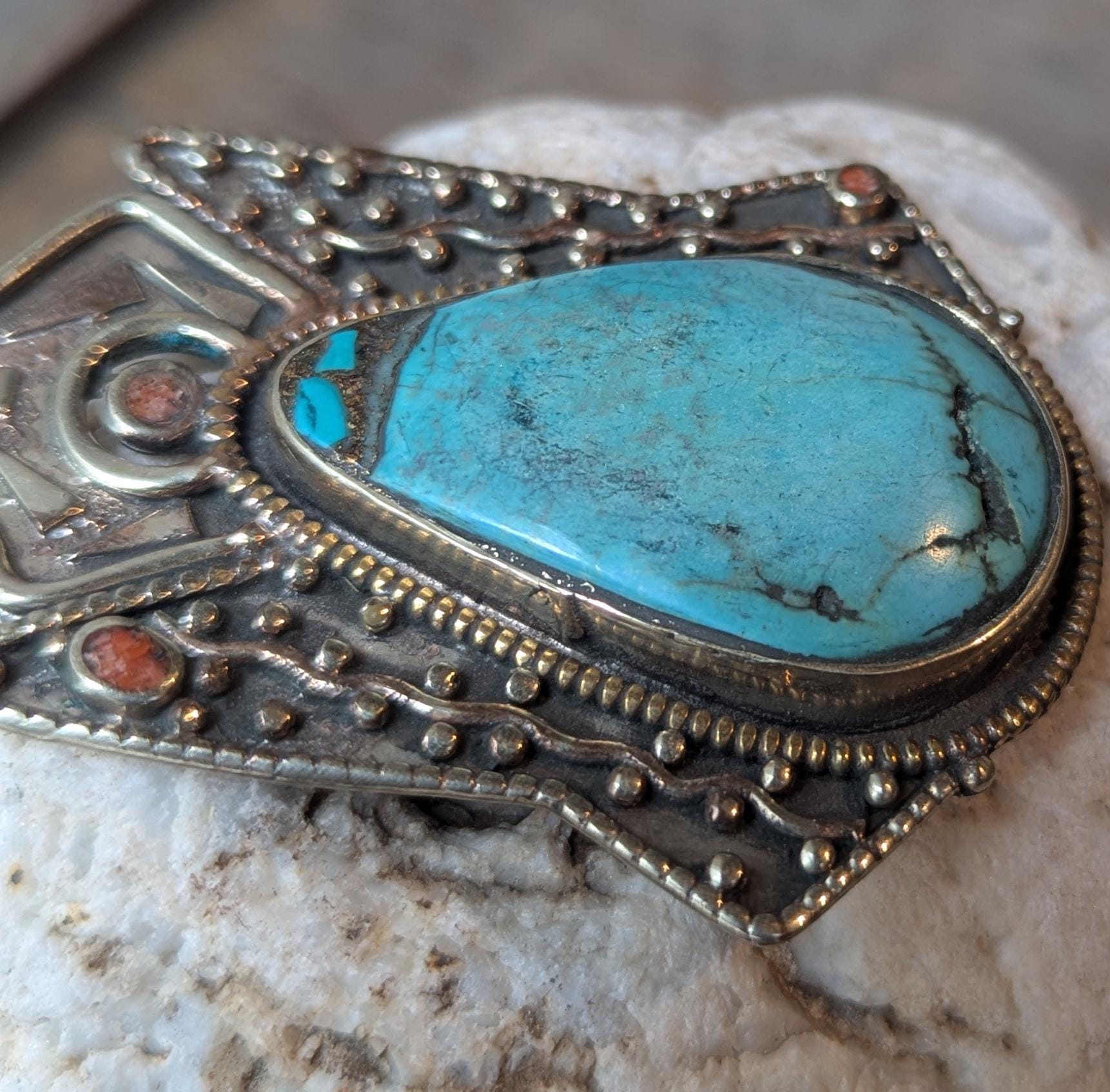Tibetan antique ethnic pendant adorned with turquoise and coral inlays. (p6-002)
